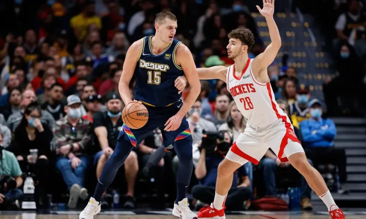 Houston Rockets center Alperen Sengun defends Denver Nuggets center Nikola Jokić