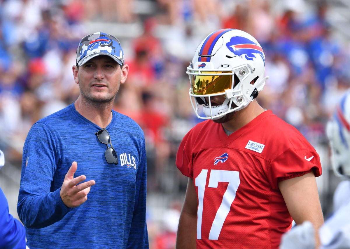 Jul 27, 2022; Pittsford, NY, USA; Buffalo Bills offensive coordinator Ken Dorsey talks with quarterback Josh Allen (17) during training camp at St. John Fisher University. Mandatory Credit: Mark Konezny-USA TODAY Sports