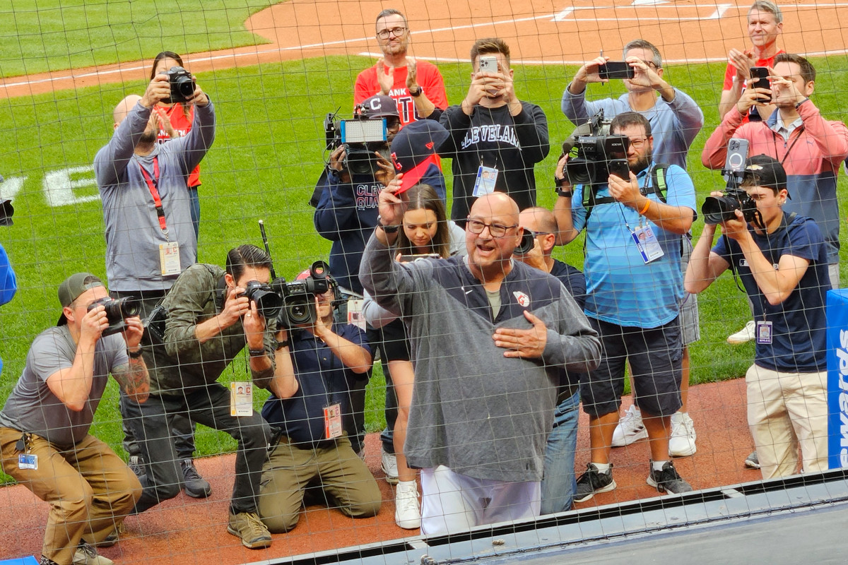 Sep 27, 2023; Cleveland, Ohio, USA; Cleveland Guardians manager Terry Francona (77) waves to cheering fans after a video tribute in his honor was broadcast on the scoreboard before a game against the Cincinnati Reds at Progressive Field.