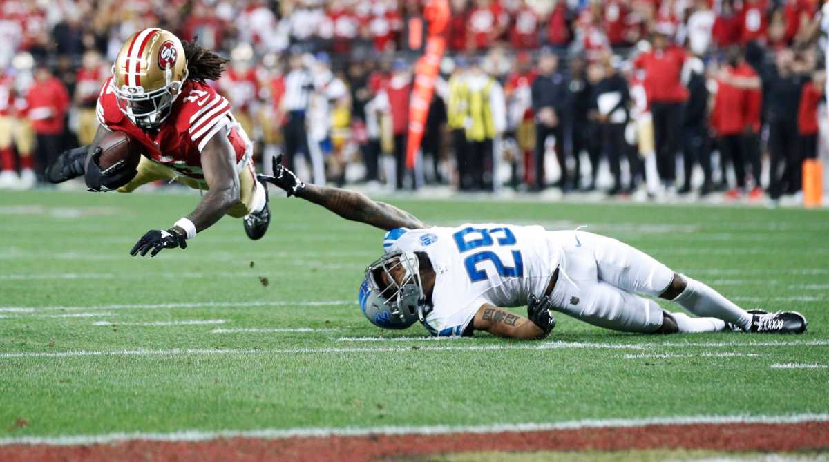 Wide receiver Brandon Aiyuk catches a ball over Lions cornerback Kindle Vildor in the third quarter of the NFC championship game
