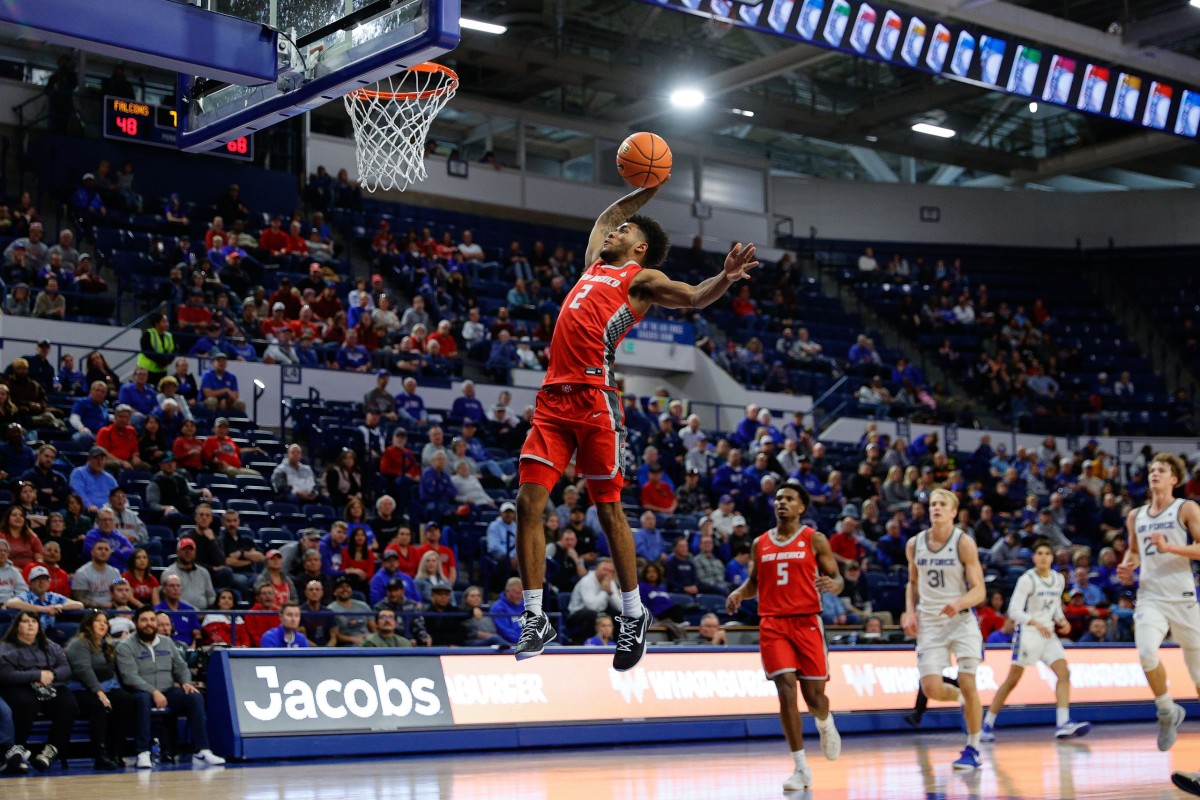 Jan 20, 2024; Colorado Springs, Colorado, USA; New Mexico Lobos guard Donovan Dent (2) dunks the ball in the second half against the Air Force Falcons at Clune Arena.