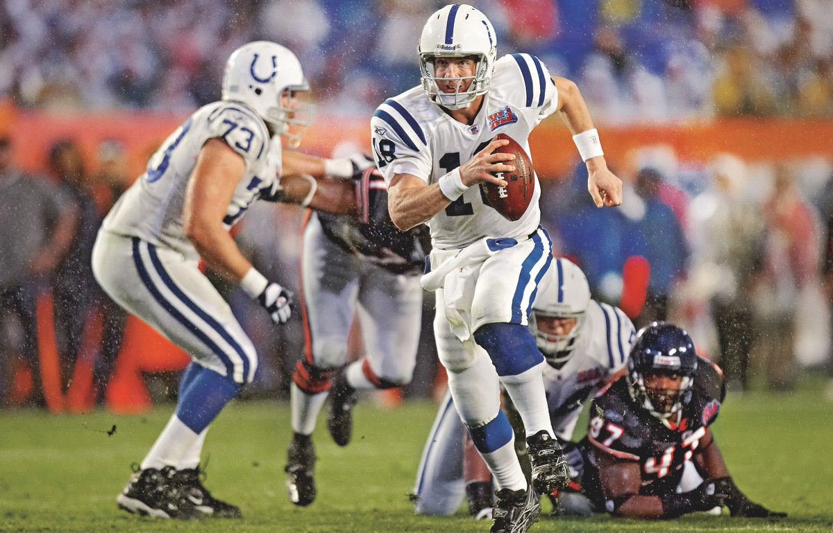 Peyton Manning runs with the ball
