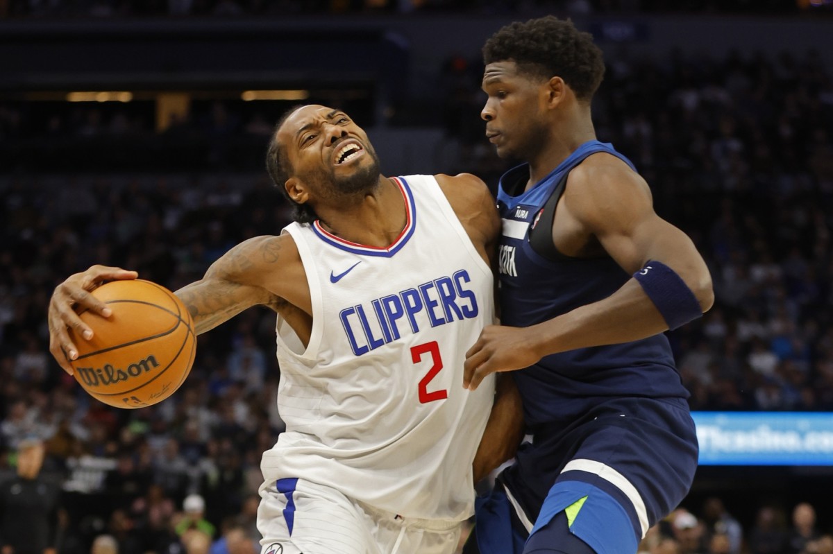 Jan 14, 2024; Minneapolis, Minnesota, USA; Los Angeles Clippers forward Kawhi Leonard (2) works around Minnesota Timberwolves guard Anthony Edwards (5) in the fourth quarter at Target Center.