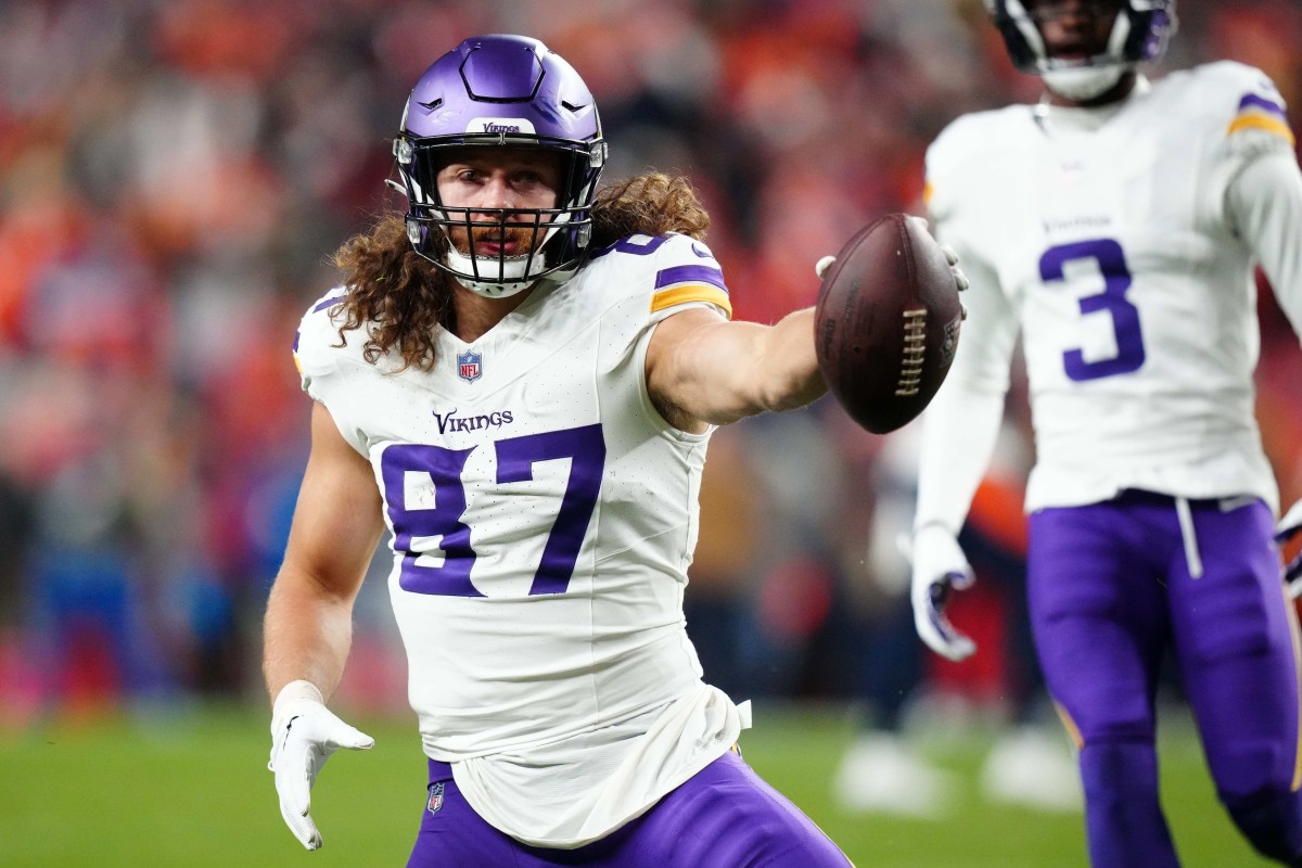 Nov 19, 2023; Denver, Colorado, USA; Minnesota Vikings tight end T.J. Hockenson (87) reacts after making a catch against the Denver Broncos in the first half at Empower Field at Mile High.