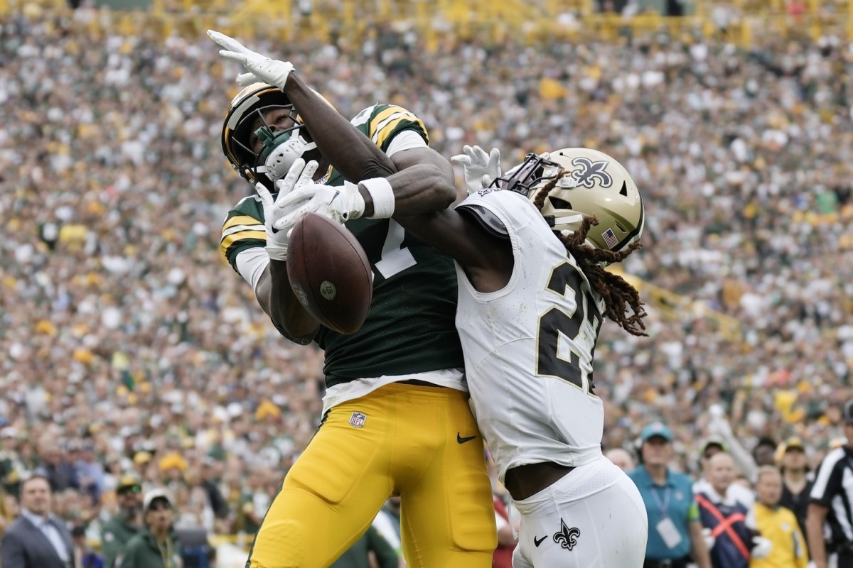 Sep 24, 2023; New Orleans Saints cornerback Isaac Yiadom (27) breaks up a pass intended for Green Bay Packers receiver Romeo Doubs (87). Mandatory Credit: Jeff Hanisch-USA TODAY Sports