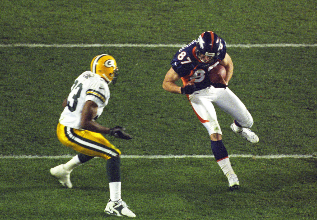  Jan 25, 1998; San Diego, CA, USA; FILE PHOTO; Denver Broncos receiver Ed McCaffrey (87) runs with the ball against Green Bay Packers defensive back Doug Evans (33) during Super Bowl XXXII at Qualcomm Stadium. The Broncos defeated the Packers 31-24. Mandatory Credit: Peter Brouillet-USA TODAY Sports