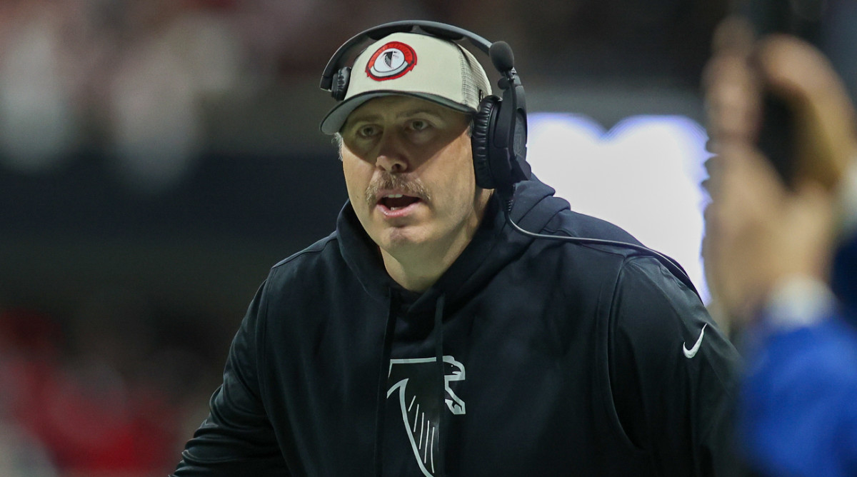 Falcons coach Arthur Smith coaches the team from the sidelines.