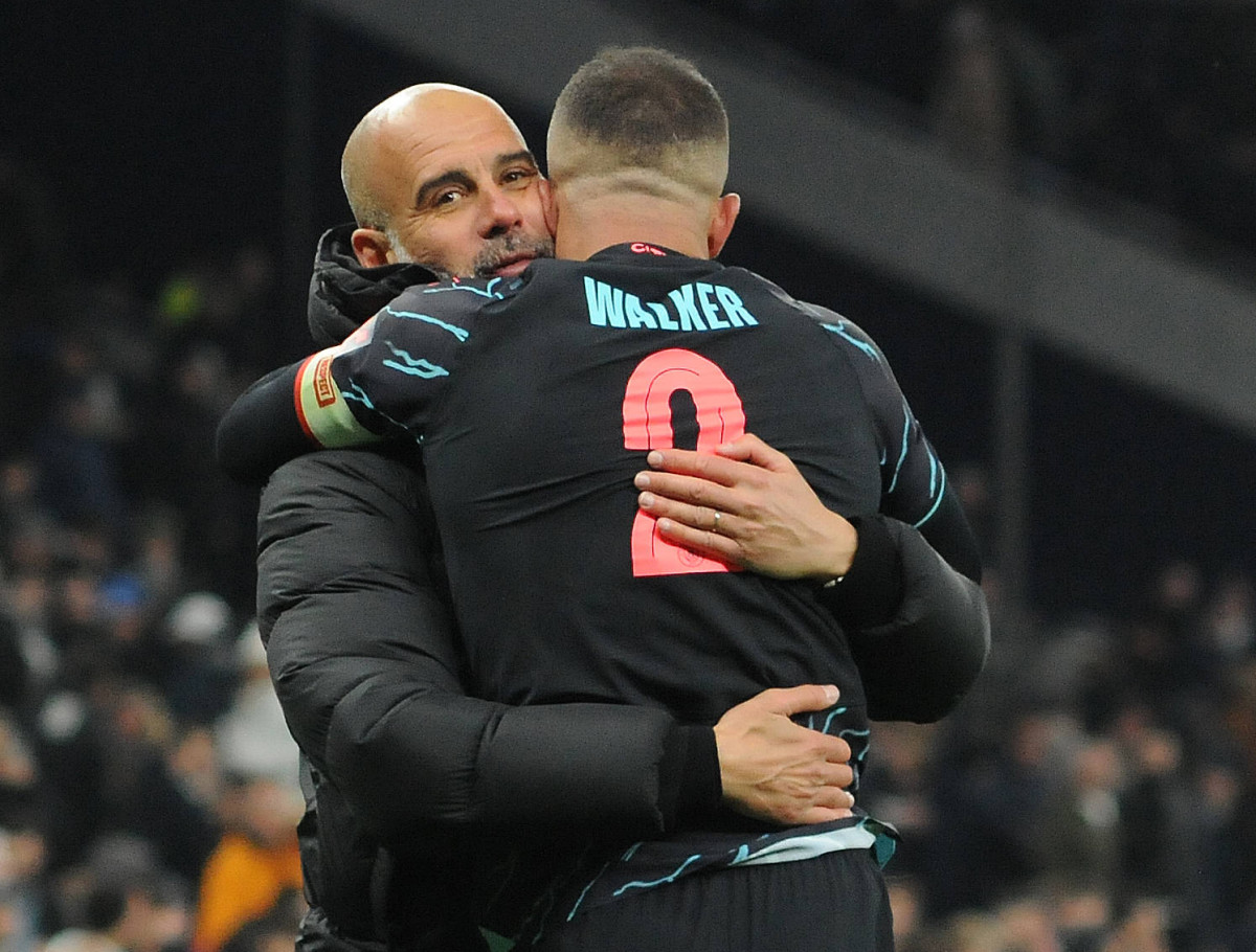 Manchester City manager Pep Guardiola pictured (left) hugging Kyle Walker following a 1-0 win at Tottenham Hotspur in January 2024