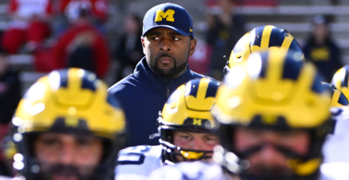 Michigan Wolverines head coach Sherrone Moore with his team before a college football game in the Big Ten.